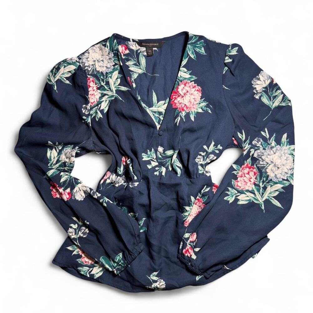 Navy blue floral print long sleeve blouse with V-neck and cinched waist